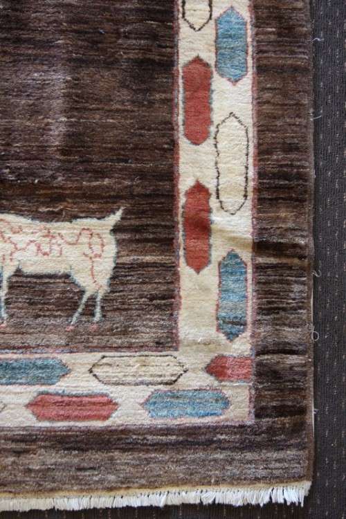 A stylish & unusual brown Iranian Meshkin Persian Carpet w/ deer motifs & centre medallion