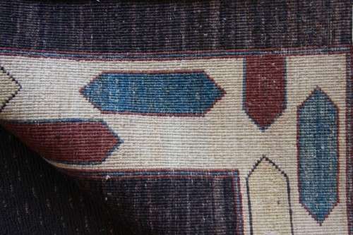 A stylish & unusual brown Iranian Meshkin Persian Carpet w/ deer motifs & centre medallion