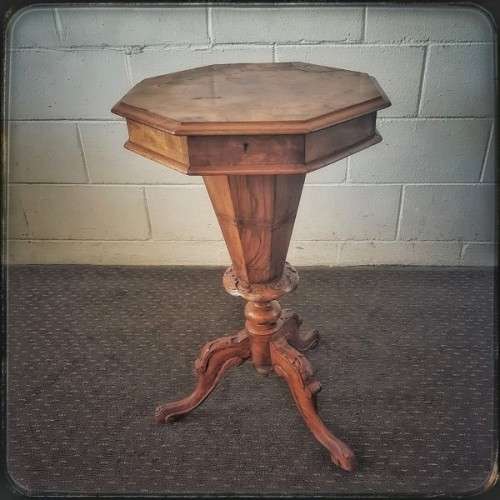 An incredible antique (c1890's) Victorian walnut octagonal sewing table w/ an array of compartments