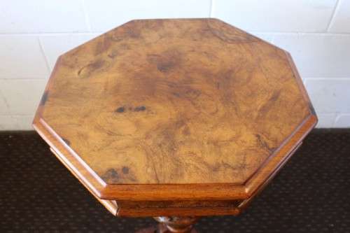 An incredible antique (c1890's) Victorian walnut octagonal sewing table w/ an array of compartments