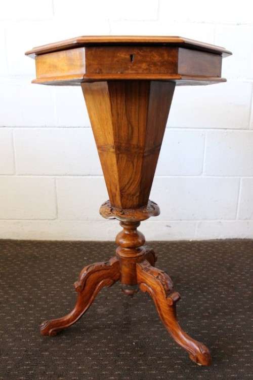 An incredible antique (c1890's) Victorian walnut octagonal sewing table w/ an array of compartments
