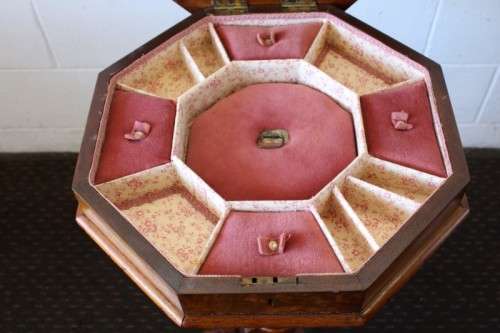 An incredible antique (c1890's) Victorian walnut octagonal sewing table w/ an array of compartments