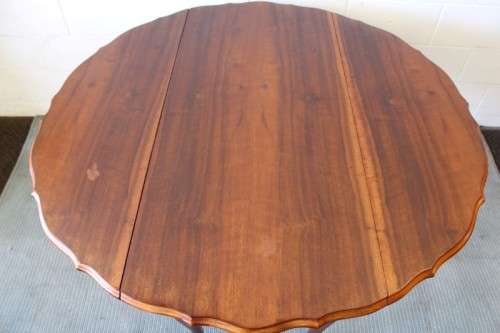 A stunning vintage solid imbuia drop-leaf dining table with beautiful slender Queen Anne legs