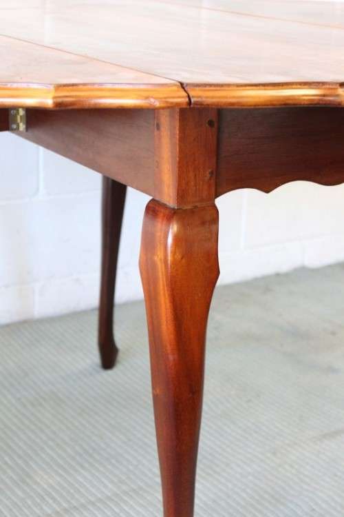 A stunning vintage solid imbuia drop-leaf dining table with beautiful slender Queen Anne legs