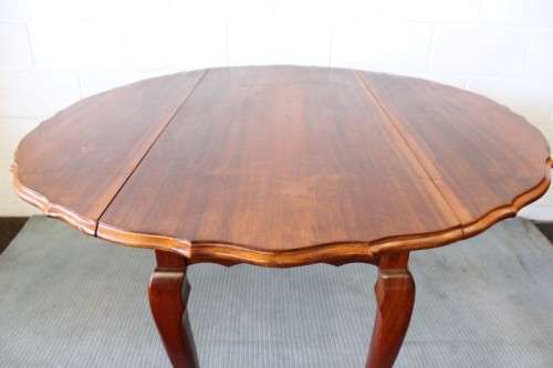 A stunning vintage solid imbuia drop-leaf dining table with beautiful slender Queen Anne legs