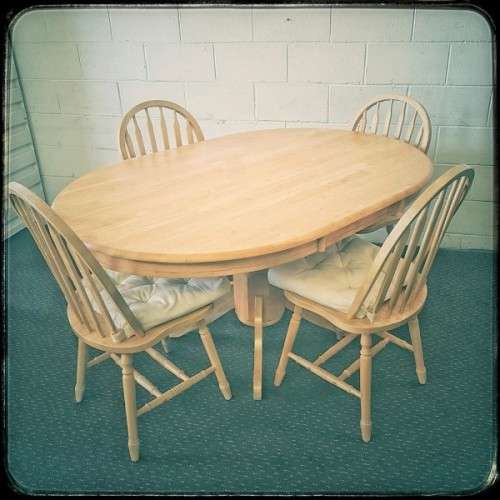 A stunning solid beech wood oval dining table with four gorgeous matching beech wood dining chairs