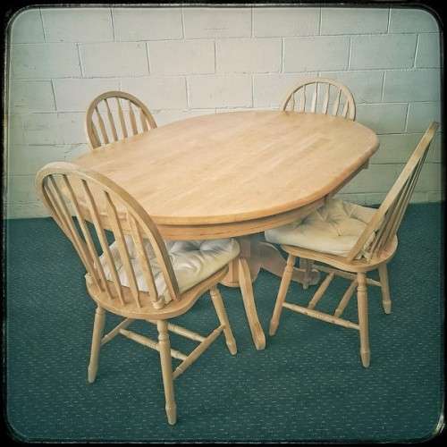 A stunning solid beech wood oval dining table with four gorgeous matching beech wood dining chairs