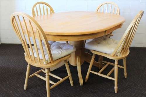 A stunning solid beech wood oval dining table with four gorgeous matching beech wood dining chairs