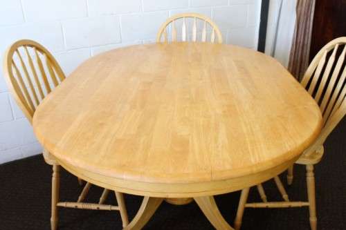 A stunning solid beech wood oval dining table with four gorgeous matching beech wood dining chairs