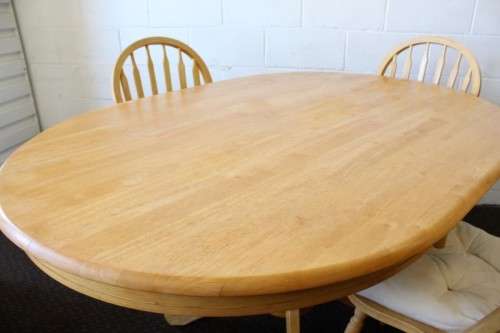 A stunning solid beech wood oval dining table with four gorgeous matching beech wood dining chairs