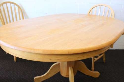 A stunning solid beech wood oval dining table with four gorgeous matching beech wood dining chairs