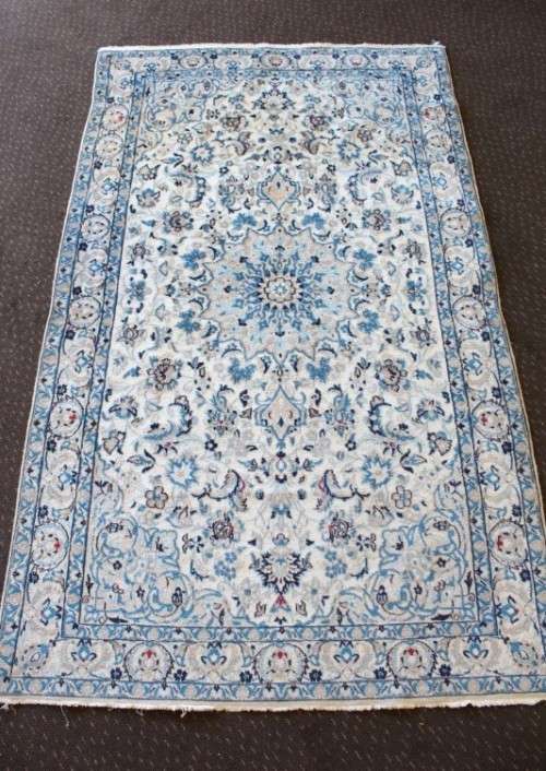 A stunning blue and white Tabriz Persian carpet in light & dark blue, white, cream & touches of red