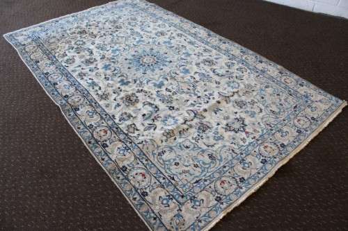 A stunning blue and white Tabriz Persian carpet in light & dark blue, white, cream & touches of red