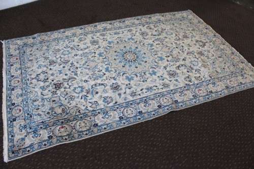 A stunning blue and white Tabriz Persian carpet in light & dark blue, white, cream & touches of red