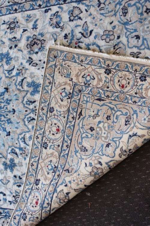 A stunning blue and white Tabriz Persian carpet in light & dark blue, white, cream & touches of red