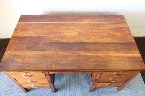 A beautiful vintage 6-drawer solid teak knee-hole partners desk with pull-out writing tops