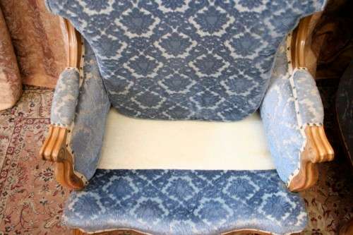 Two elegant hand carved Victorian arm chairs with deep button detailing & gorgeous blue fabric.