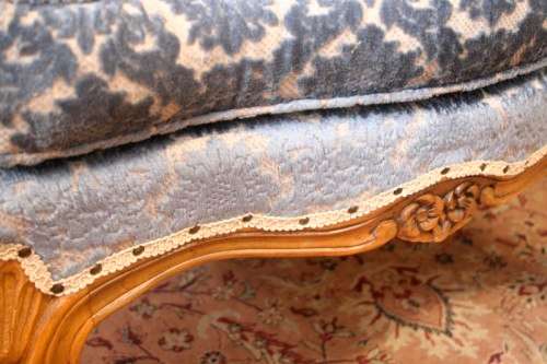 Two elegant hand carved Victorian arm chairs with deep button detailing & gorgeous blue fabric.