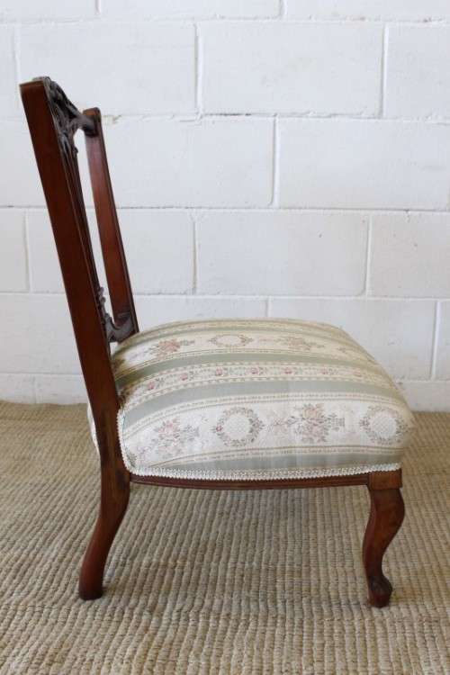 **RS17** A hand-carved antique Victorian slipper/ nursing chair upholstered in a beautiful fabric