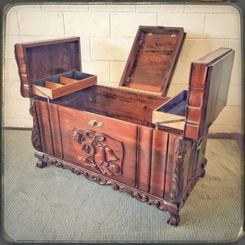 A stunning and beautiful hand carved solid Imbuia ball & claw kist with a 3-way lid & ample space