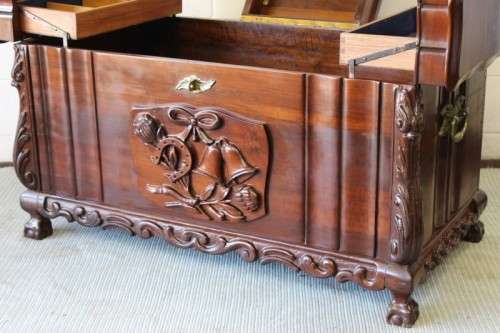 A stunning and beautiful hand carved solid Imbuia ball & claw kist with a 3-way lid & ample space