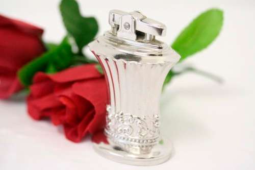 A spectacular vintage (1947) silver plate "Ronson New Port Table Lighter" made in England.