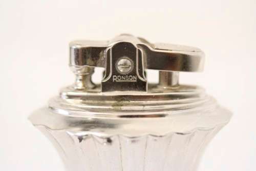 A spectacular vintage (1947) silver plate "Ronson New Port Table Lighter" made in England.