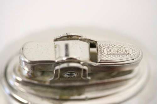 A spectacular vintage (1947) silver plate "Ronson New Port Table Lighter" made in England.