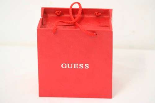 A stunning "GUESS" ladies wrist watch with patterned chains and coloured stone charms.