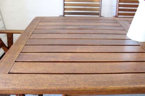 A fabulous 6-seater solid Sapele wood, all weather "Outback" outdoor patio table with 6 armchairs