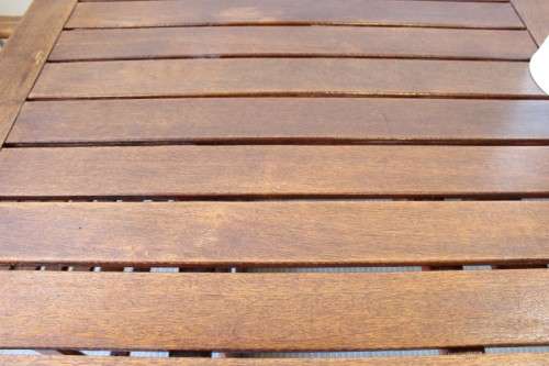 A fabulous 6-seater solid Sapele wood, all weather "Outback" outdoor patio table with 6 armchairs