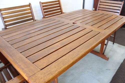 A fabulous 6-seater solid Sapele wood, all weather "Outback" outdoor patio table with 6 armchairs