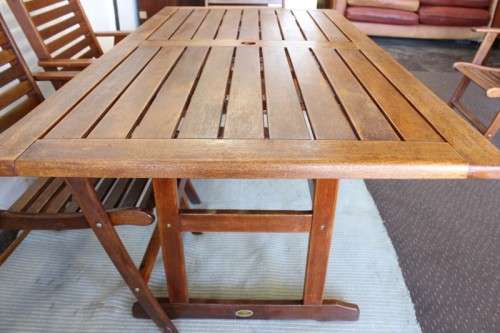 A fabulous 6-seater solid Sapele wood, all weather "Outback" outdoor patio table with 6 armchairs
