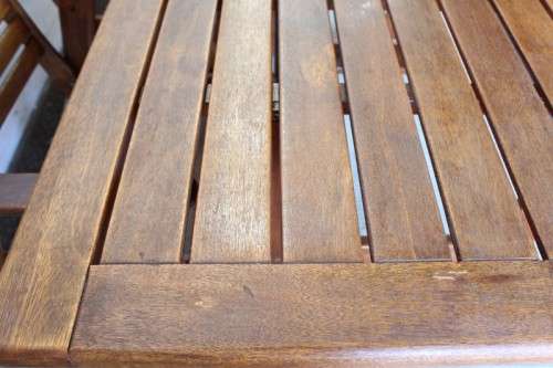 A fabulous 6-seater solid Sapele wood, all weather "Outback" outdoor patio table with 6 armchairs