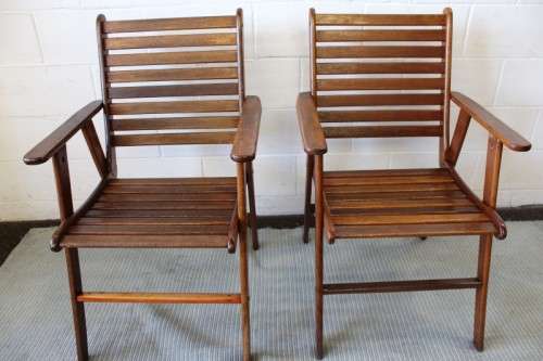 A fabulous 6-seater solid Sapele wood, all weather "Outback" outdoor patio table with 6 armchairs