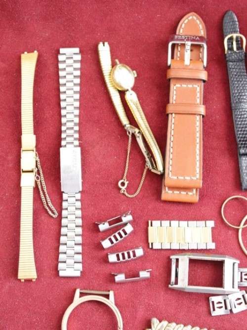 An incredible collection of assorted watchmaker spares including straps, links, bezels and more