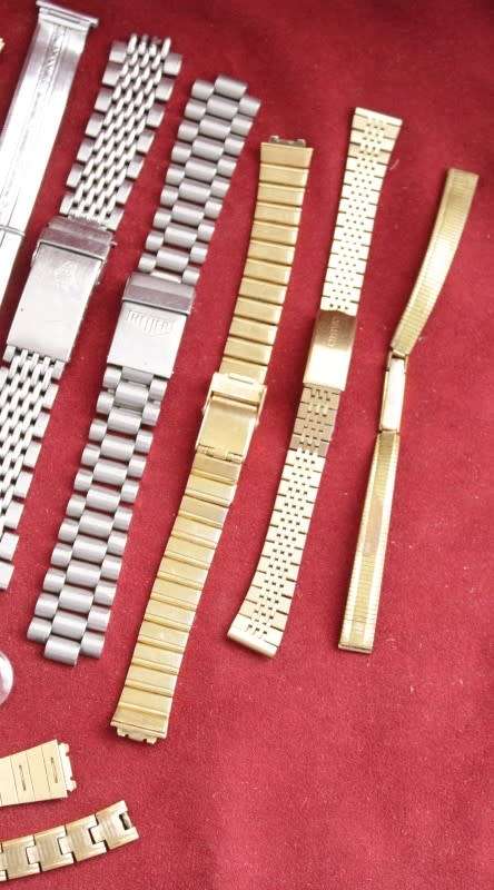An incredible collection of assorted watchmaker spares including straps, links, bezels and more