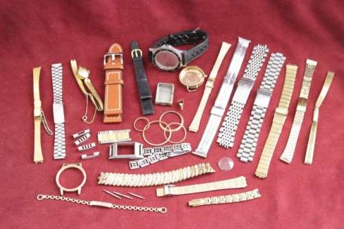 An incredible collection of assorted watchmaker spares including straps, links, bezels and more