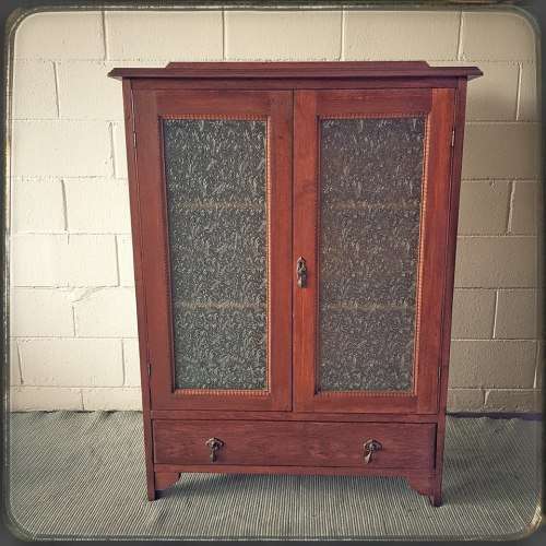 An amazing vintage Teak bookcase/ cabinet with decorative frosted glass doors and a bottom drawer!