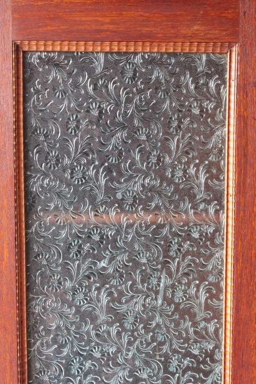 An amazing vintage Teak bookcase/ cabinet with decorative frosted glass doors and a bottom drawer!