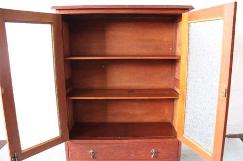 An amazing vintage Teak bookcase/ cabinet with decorative frosted glass doors and a bottom drawer!