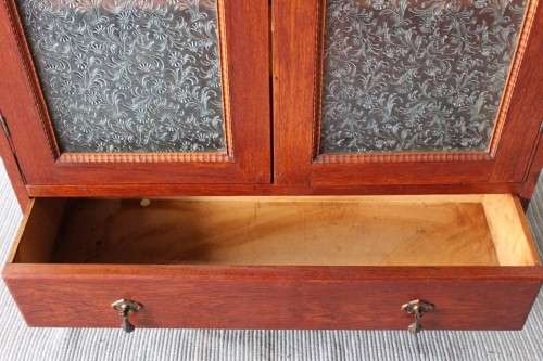 An amazing vintage Teak bookcase/ cabinet with decorative frosted glass doors and a bottom drawer!