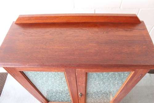 An amazing vintage Teak bookcase/ cabinet with decorative frosted glass doors and a bottom drawer!