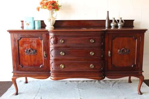 An exquisite LARGE vintage side server with pad foot legs and stunning carved wooden rosettes!