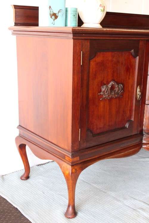 An exquisite LARGE vintage side server with pad foot legs and stunning carved wooden rosettes!