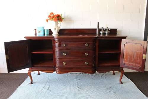 An exquisite LARGE vintage side server with pad foot legs and stunning carved wooden rosettes!