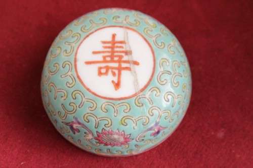 A beautiful and detailed jade-green oriental ginger jar & lid with hand painted symbols and flowers