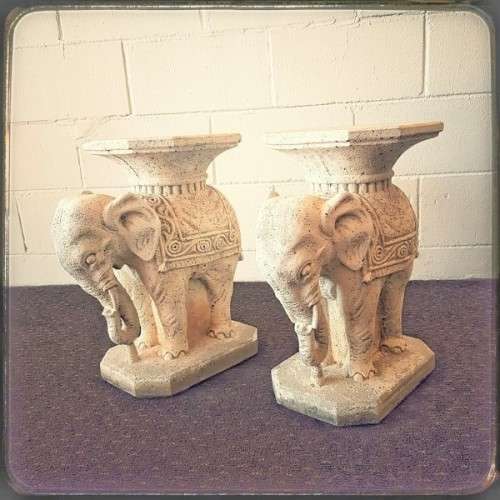 A gorgeous solid concrete outdoor garden bench with beautifully detailed "elephant" leg supports