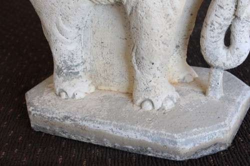 A gorgeous solid concrete outdoor garden bench with beautifully detailed "elephant" leg supports