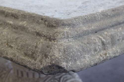 A gorgeous solid concrete outdoor garden bench with beautifully detailed "elephant" leg supports